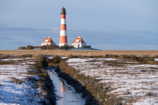 Panoramic image of Westerhever lighthouse during wintertime, North Frisia, Germany 