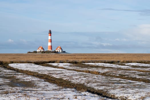 Panoramic image of Westerhever lighthouse during wintertime, North Frisia, Germany 