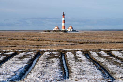 Panoramic image of Westerhever lighthouse during wintertime, North Frisia, Germany 