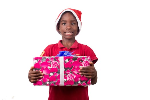 Unpack the Christmas present. Happy childhood concept. Holiday and party tradition. Kid with a Christmas present in hand.