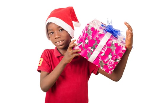 Unpack the Christmas present. Happy childhood concept. Holiday and party tradition. Kid with a Christmas present in hand.