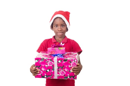 Unpack the Christmas present. Happy childhood concept. Holiday and party tradition. Kid with a Christmas present in hand.