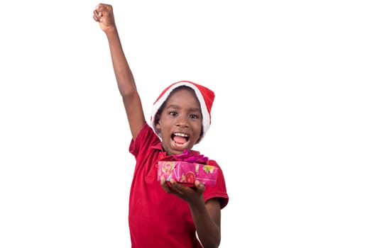 Unpack the Christmas present. Happy childhood concept. Holiday and party tradition. Kid with a Christmas present in hand.