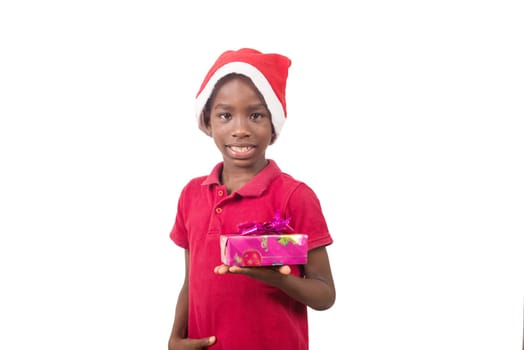 Unpack the Christmas present. Happy childhood concept. Holiday and party tradition. Kid with a Christmas present in hand.