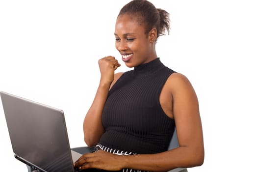 Attractive beautiful businesswoman having success in business. Charming beautiful woman holding a laptop and looking for some business information.