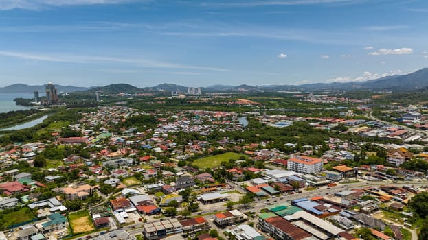 Aerial view of Kota Kinabalu with residential areas, streets and houses. Borneo,Sabah, Malaysia.