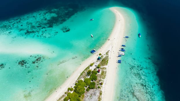 Top view of beautiful Sibuan island with a beach and a coral atoll. Tun Sakaran Marine Park. Borneo, Sabah, Malaysia.