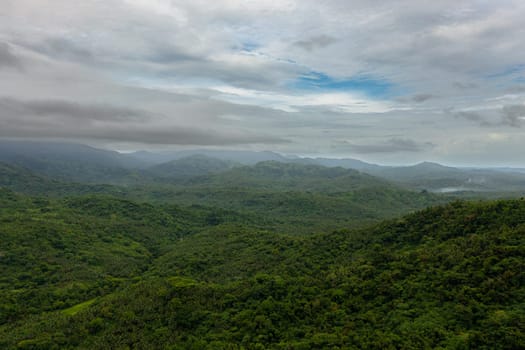 Aerial view of Mountain peaks covered with forest from above. Philippines.