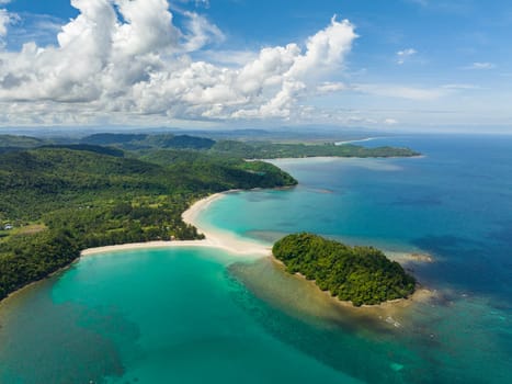 Sandy beach and turquoise water of the tropical sea. Kelambu Beach. Borneo, Malaysia.