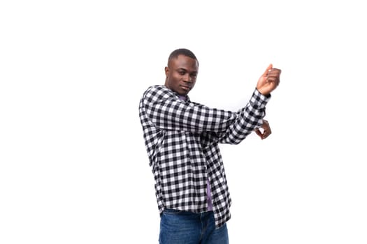 nice young american guy with short hair dressed casually dancing on a white background with copy space.