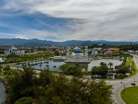 Mosque Bandaraya Kota and panorama of the city. Kinabalu. Sabah, Borneo. Malaysia.