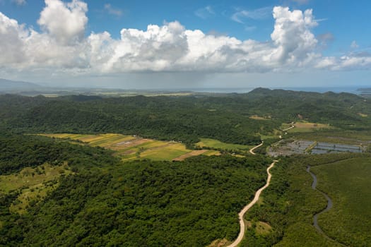 Mountain slopes with rainforest and a mountain valley with farmland.Philippines.