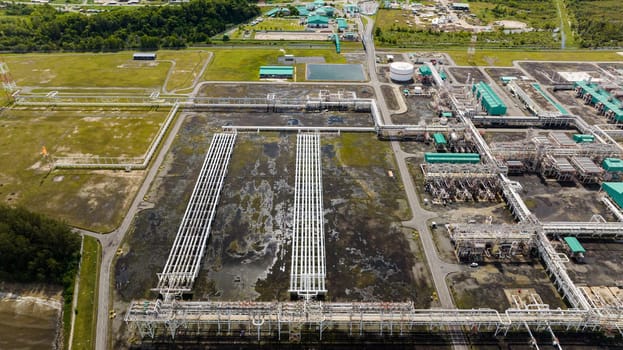 Large above ground tanks store oil and gas in an oil refinery. Borneo, Sabah, Malaysia.