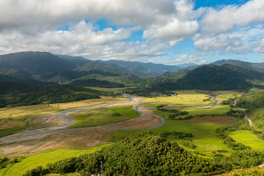Top view of Mountains with tropical forest and blue ocean. Tropical landscape. Philippines.
