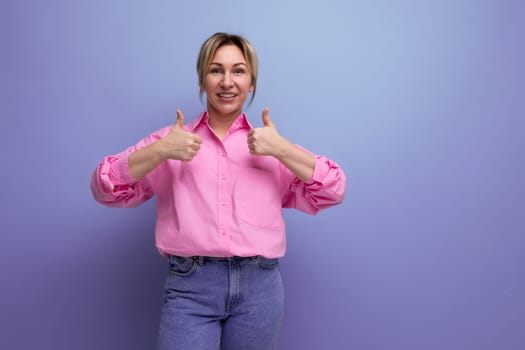 pretty businesswoman in pink shirt pointing finger at small business idea on studio background with copy space.