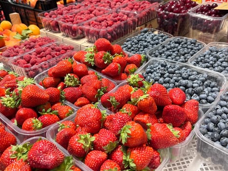 City market view with strawberries, heathberry and raspberry tasty colorfull look. High quality photo