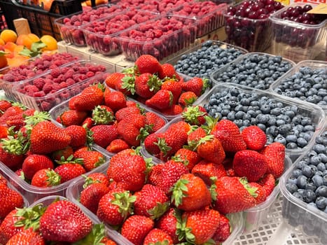 City market view with strawberries, heathberry and raspberry tasty colorfull look. High quality photo