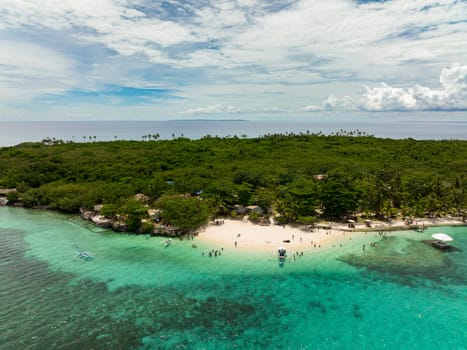 Beautiful sandy beach on a tropical island. Virgin Island, Philippines.