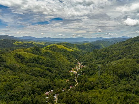Aerial view of mountain slopes covered with rainforest and jungle. Sumatra, Indonesia.