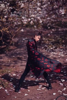Beautiful dramatic young woman wearing kimono with cherry blossoms, sakura view. High quality photo