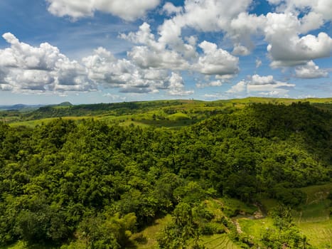 Top view of mountain slopes with farmland of farmers. Negros, Philippines