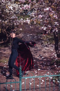 Beautiful dramatic young woman wearing kimono with cherry blossoms, sakura view. High quality photo