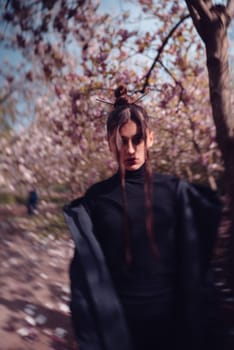 Beautiful dramatic young woman wearing kimono with cherry blossoms, sakura view. High quality photo