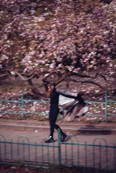 Beautiful dramatic young woman wearing kimono with cherry blossoms, sakura view. High quality photo