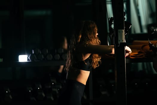 Athletic Beautiful Woman Does Her Cross Fitness, Bodybuilding Gym Training Routine