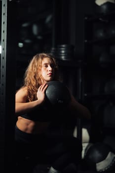 Athletic Beautiful Woman Does Her Cross Fitness, Bodybuilding Gym Training Routine