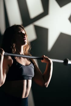 Athletic Beautiful Woman with barbell, Bodybuilding Gym Training Routine