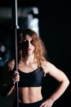 Athletic Beautiful Woman Does Her Cross Fitness, Bodybuilding Gym Training Routine
