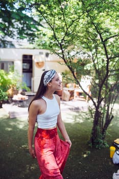 Happy hippie girl are having a good time in a camper trailer. Holiday, vacation, trip concept.High quality photo