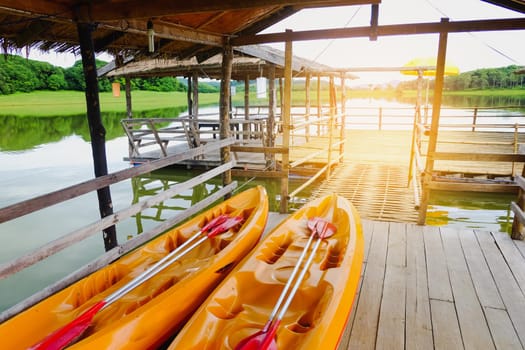 two kayaks park at river