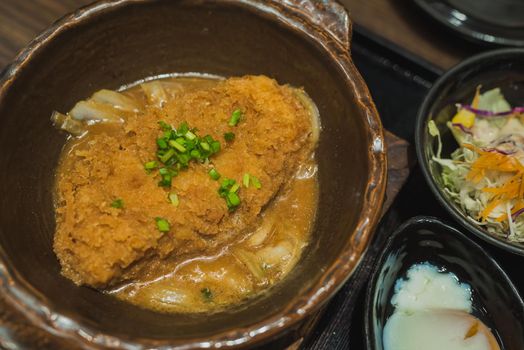 Deep Fired pork boiled with fresh egg top on the rice bowl. basic Japanese food