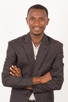 Portrait of a happy african american young businessman isolated on a light background