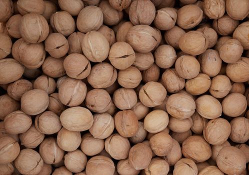 Top view of walnuts in nutshells.Healthy organic food concept.