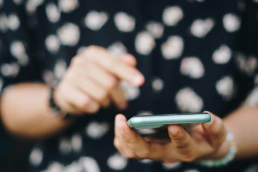 Woman hand using smartphone to do work business, social network, communication concept.