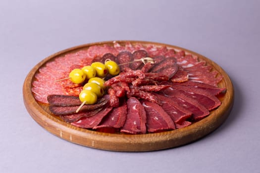 meat sliced from delicacies on a wooden stand.