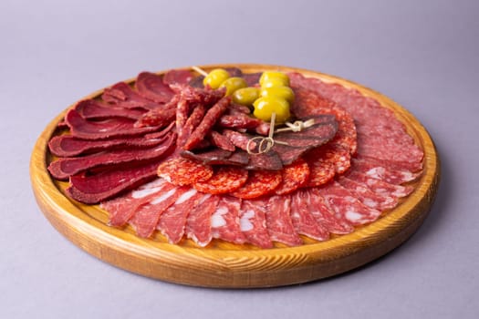 meat sliced from delicacies on a wooden stand.