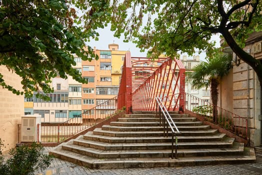 Bridge in Girona, Catalonia, Spain: Eiffel Bridge constructed by Gustave Eiffel over the Onyar River in Girona, Catalonia, Spain.