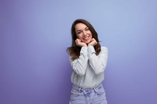 young brown-haired woman smiling coquettishly.