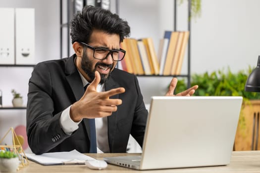Conflict Quarrel Negotiation. Angry businessman ceo making webcam laptop online video call at office. Upset mad freelancer man talking colleague conversation analyzing financial report mistake problem