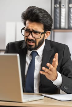 Conflict Quarrel Negotiation. Angry businessman ceo making webcam laptop online video call at office. Upset mad freelancer man talking colleague conversation analyzing financial report mistake problem