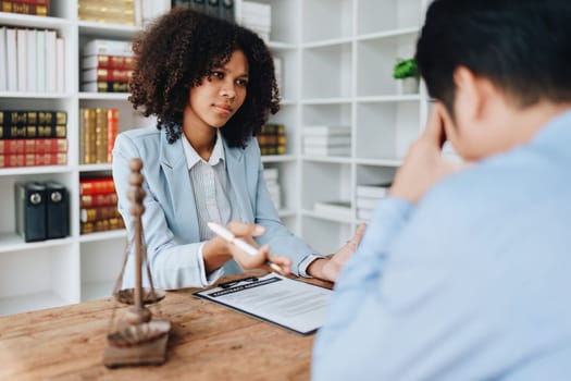 african american attorney, lawyers discussing contract or business agreement at law firm office, Business people making deal document legal, justice advice service concepts.