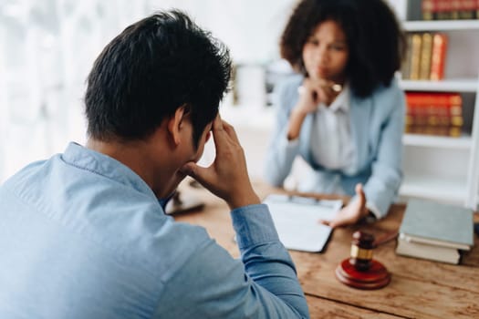 african american attorney, lawyers discussing contract or business agreement at law firm office, Business people making deal document legal, justice advice service concepts.