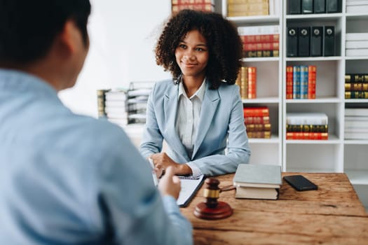 african american attorney, lawyers discussing contract or business agreement at law firm office, Business people making deal document legal, justice advice service concepts.