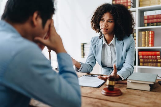 african american attorney, lawyers discussing contract or business agreement at law firm office, Business people making deal document legal, justice advice service concepts.