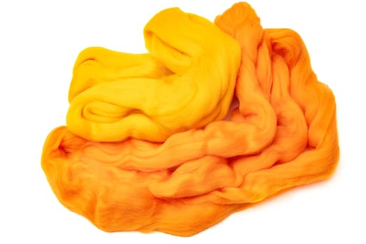 Merino wool for felting shades of yellow is isolated on a white background.