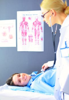 Doctor and patient discussing something while sitting at the table . Medicine and health care concept.